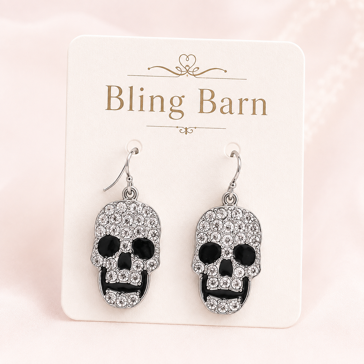 Midnight Skull Rhinestone Earrings displayed on a Bling Barn jewelry card