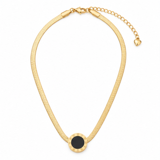 A gold snake chain necklace featuring a circular pendant with a textured gold border and a smooth black center, displayed on a clean white background.