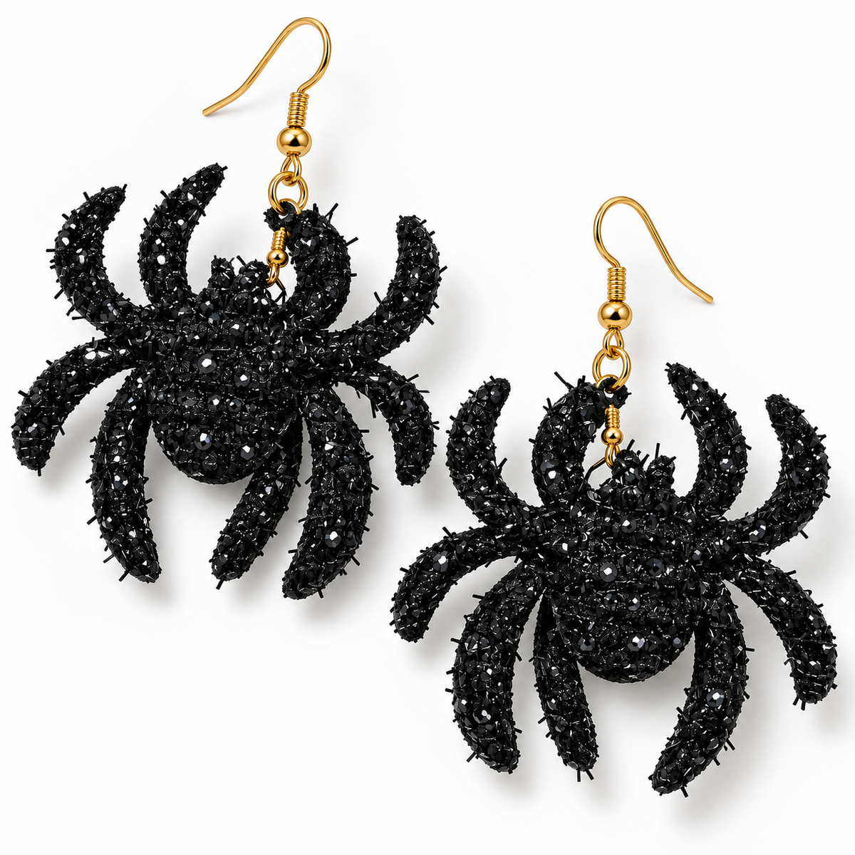 A pair of black spider-shaped dangling earrings with gold fishhook ear wires, shown on a plain white background.