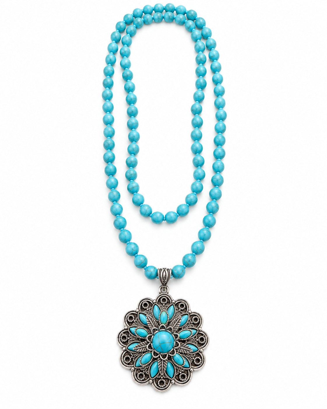 A turquoise beaded necklace with a large silver filigree pendant featuring a turquoise center, displayed on a clean white background.