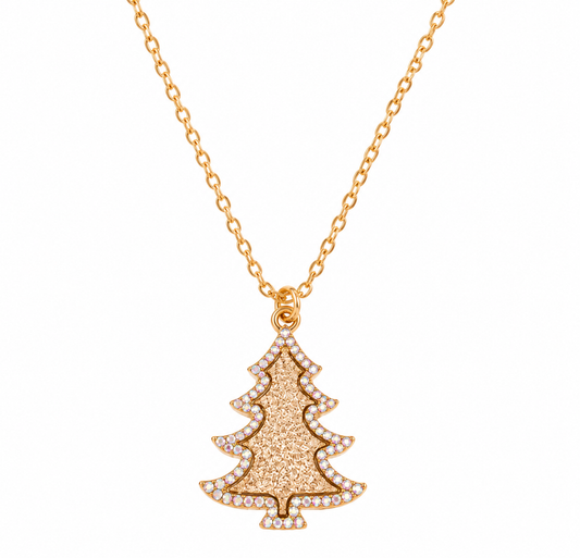 A gold Christmas tree pendant necklace adorned with small clear stones, suspended from a delicate gold chain on a solid white background.