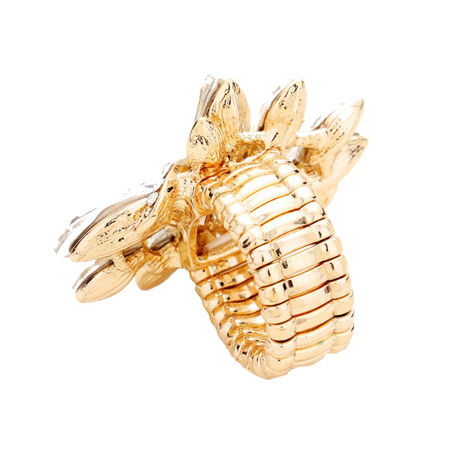 Gold-colored sea horse figurine on a white background