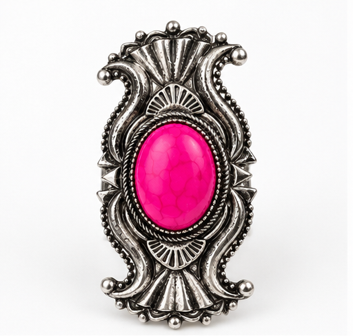 A silver-toned Western-style ring featuring a vibrant pink cabochon stone in an ornate, scalloped bezel setting, shown against a plain white background.