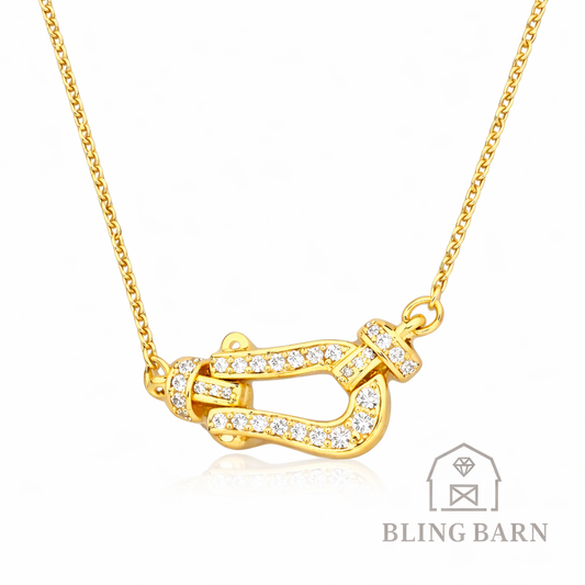 Gold necklace with a unique design on a white background, featuring the brand 'Bling Barn'.