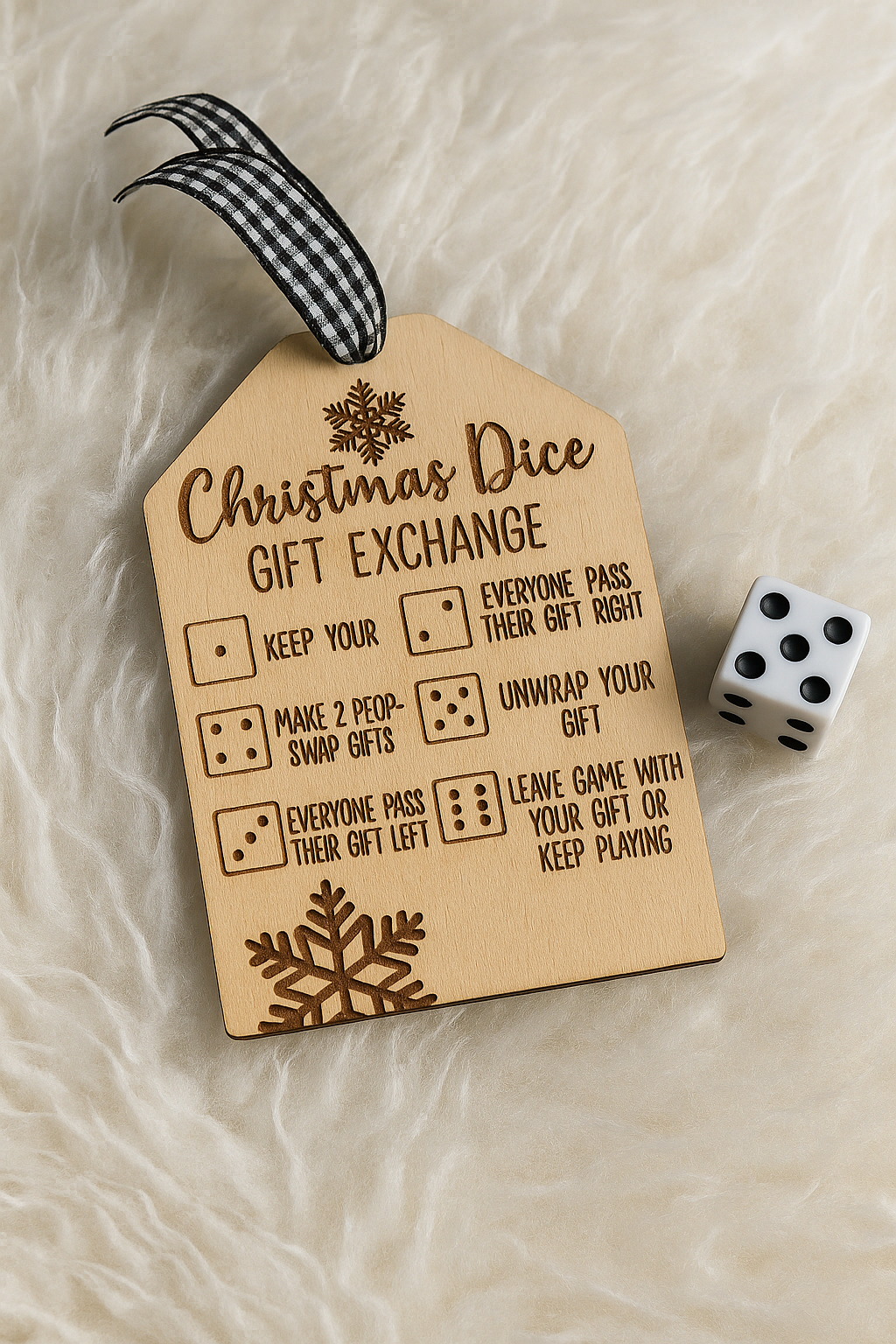 Wooden tag with Christmas dice gift exchange rules and a die on a textured surface